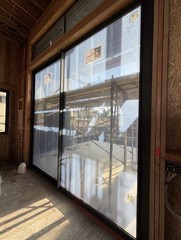 Fleetwood Series 3000 XO Sliding Door Black Aluminum Low-E Glass 128×120 in