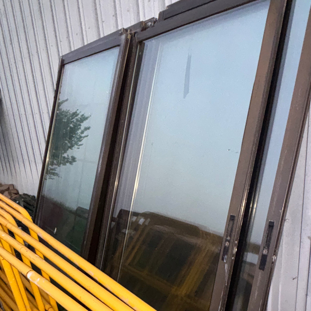 Brown Aluminum Sliding Window, Tinted Single-Pane Glass, Venting, Frame
